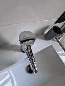 a bathroom sink with a chrome faucet at Dormire a Reggio zona Aeroporto in Reggio di Calabria