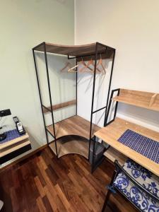 a room with a closet with shelves and a table at Dormire a Reggio zona Aeroporto in Reggio di Calabria