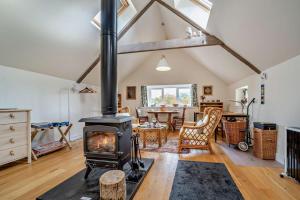 a living room with a fireplace and a dining room at 1 Bed in Broughton oc-b30218 in Broughton +16 photos