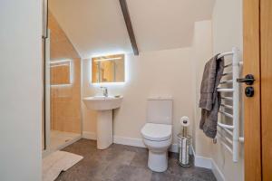 a bathroom with a toilet and a sink and a shower at 1 Bed in Broughton oc-b30218 in Broughton