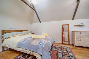 a bedroom with a bed and a dresser at 1 Bed in Broughton oc-b30218 in Broughton