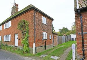 an old brick building with a ivy growing on it at 3 Bed in Westleton oc-swc in Westleton
