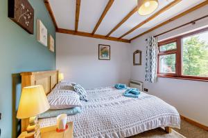 a bedroom with a bed and a window at 2 Bed in Aberystwyth oc-99869 in Devils Bridge