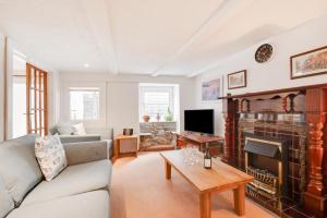 a living room with a couch and a fireplace at 3 Bed in St Ives oc-pc1016 in St Ives