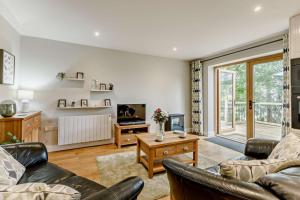 a living room with two couches and a tv at 2 Bed in Beer oc-s27769 in Beer