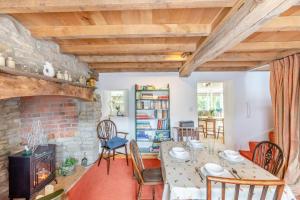 a living room with a table and a fireplace at 2 Bed in Leintwardine oc-t29563 in Leintwardine