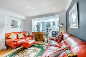 a living room with a leather couch and a table at 2 Bed in Coldingham oc-c31971 in Coldingham