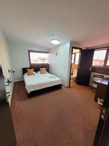 a bedroom with a bed in a room at MAG Motel in Bucharest +63 photos