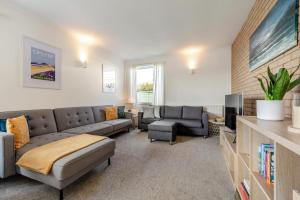 a living room with a couch and a tv at 3 Bed in Croyde oc-f33111 in Croyde