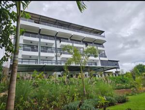 an office building with a garden in front of it at Oloisiri Namanga Hotel in Namanga