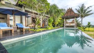 an image of a villa with a swimming pool at Umah Sunset in Ubud