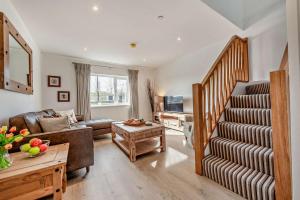 a living room with a couch and a table at 2 Bed in Llanarthney oc-c28877 in Llanarthney