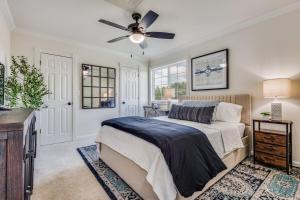 a bedroom with a bed and a ceiling fan at LWV Dallas Social - Lakewood Village in Little Elm +34 photos