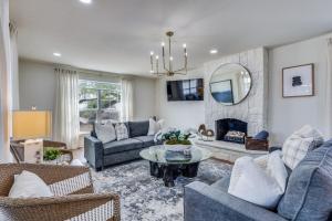 a living room with couches and a fireplace at LWV Dallas Social - Lakewood Village in Little Elm