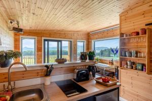 a kitchen with wooden walls and a wooden ceiling at 2 Bed in Strathmiglo oc-w32098 in Strathmiglo