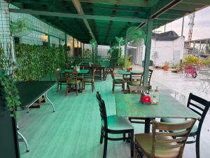 a restaurant with tables and chairs on a patio at Colonial Hotel Boutique by VBermor in Santo Domingo +2 photos