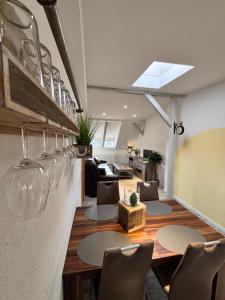 a room with tables and chairs and a living room at Ferienwohnung Elbbrise in Riesa