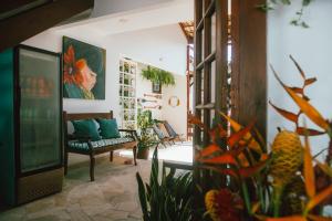 a living room with a couch and a chair at Casa Aldeia Paraty in Paraty