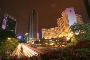 a city skyline at night with buildings at Yo Le Le Apartment in Guangzhou