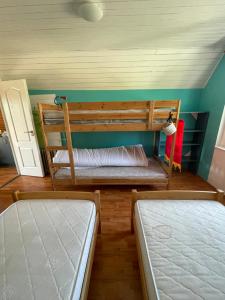 a bedroom with two bunk beds and a door at Residence at lake Balaton in Siófok