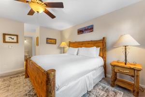 a bedroom with a large bed and a ceiling fan at Pines #2165 in Keystone +22 photos