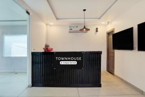 a view of a room with a townhouse sign on the wall at OYO Townhouse Deva Road Lucknow in Lucknow