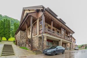 a car parked in front of a building at U GORAĽA in Lesnica