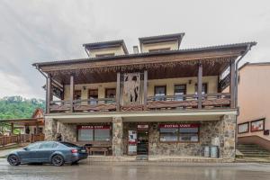 a car parked in front of a building at U GORAĽA in Lesnica