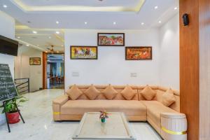 a living room with a couch and a table at Palette by CheckIn Goverdhan Villas Formerly The White Fresco in Udaipur +43 photos