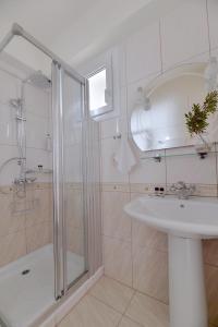 a bathroom with a shower and a sink at Ilia Mare in Ilia +33 photos