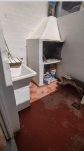 a kitchen with an open oven in a house at Complejo el Cuy in Las Grutas +3 photos