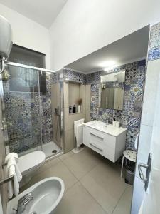 a bathroom with a toilet sink and a shower at Villa Azul in Anacapri +36 photos