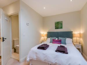 a bedroom with a bed with two towels on it at 1 Bed in York oc-g0032 in Crayke