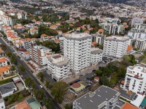 an aerial view of a city with tall buildings at Social Lodge Hollywood Studios in Funchal