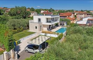 an aerial view of a house with a van parked in a driveway at Villa Mila in Vabriga