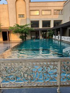 a swimming pool in the middle of a building at Pahadi Convention in Rourkela