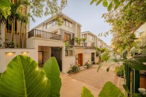 an image of a house with a brick street at Lindsay Manor AkSh Private Pool 4BHK Lift in Arpora