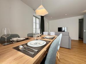 a dining room with a table with chairs and a dining room at Carducci Holiday Home in Chiavenna +21 photos
