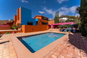 a swimming pool in front of a house at 4000 - Casa San Felipe in Oaxaca City