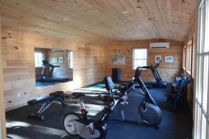 a gym with several exercise bikes in a room at Linekin Bay Resort in Boothbay Harbor
