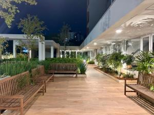 a building with benches and plants in it at City Core 2 Bedrooms by AP Smart in Campinas