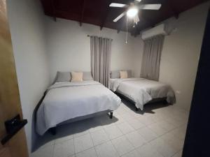 a bedroom with two beds in a room at TheWinterHouse in Crown Point +4 photos