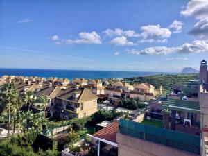 a view of a town with houses and the ocean at Anitas Seaview Paradise in La Línea de la Concepción