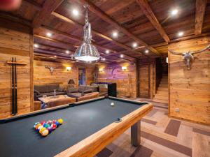 a billiard room with a pool table in a house at Chalet Caribou in Isola +2 photos