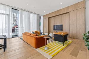 a living room with a couch and a television at Downtown Luxury Condo withPool & Skyline Views in Miami
