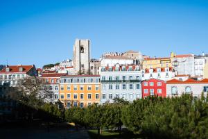 a group of buildings in a city with a tower at AlmaLusa Alfama in Lisbon