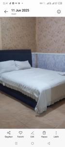 a picture of a bed in a room at Suryawijaya in Timuran