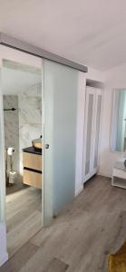 a room with a sliding glass door leading to a bedroom at Safari Beach guest house in Lagos +39 photos