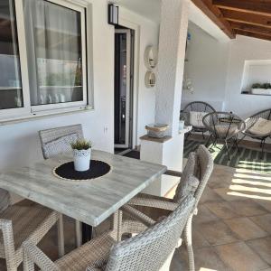 a dining room with a table and chairs at Roko Apartments in Biograd na Moru +20 photos