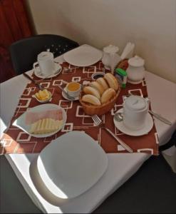 a table with a plate of food on a table at Hotel Bello, Andrés Bello 1166 in Temuco +18 photos